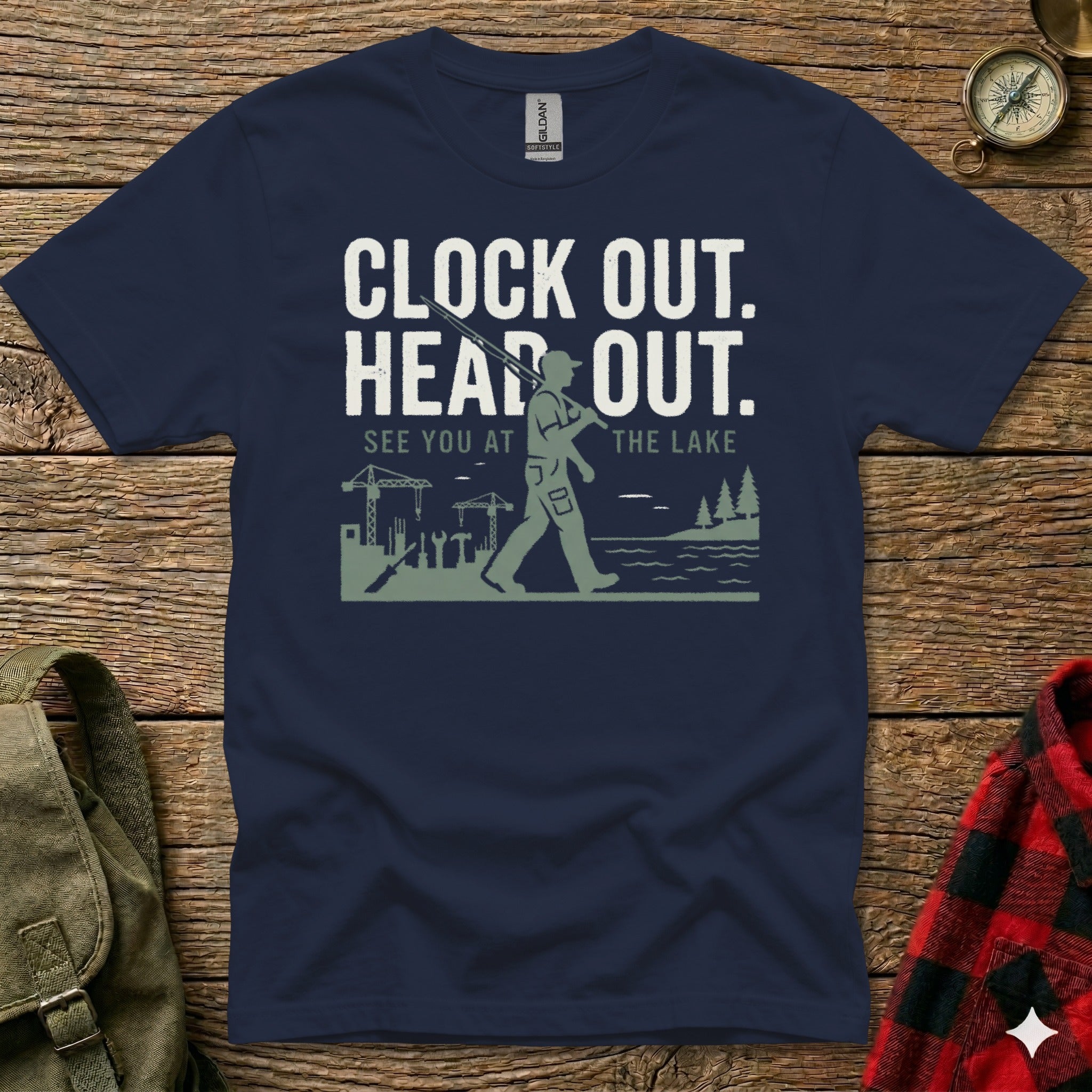 Navy t-shirt with graphic of man walking toward lake, holding rifle.