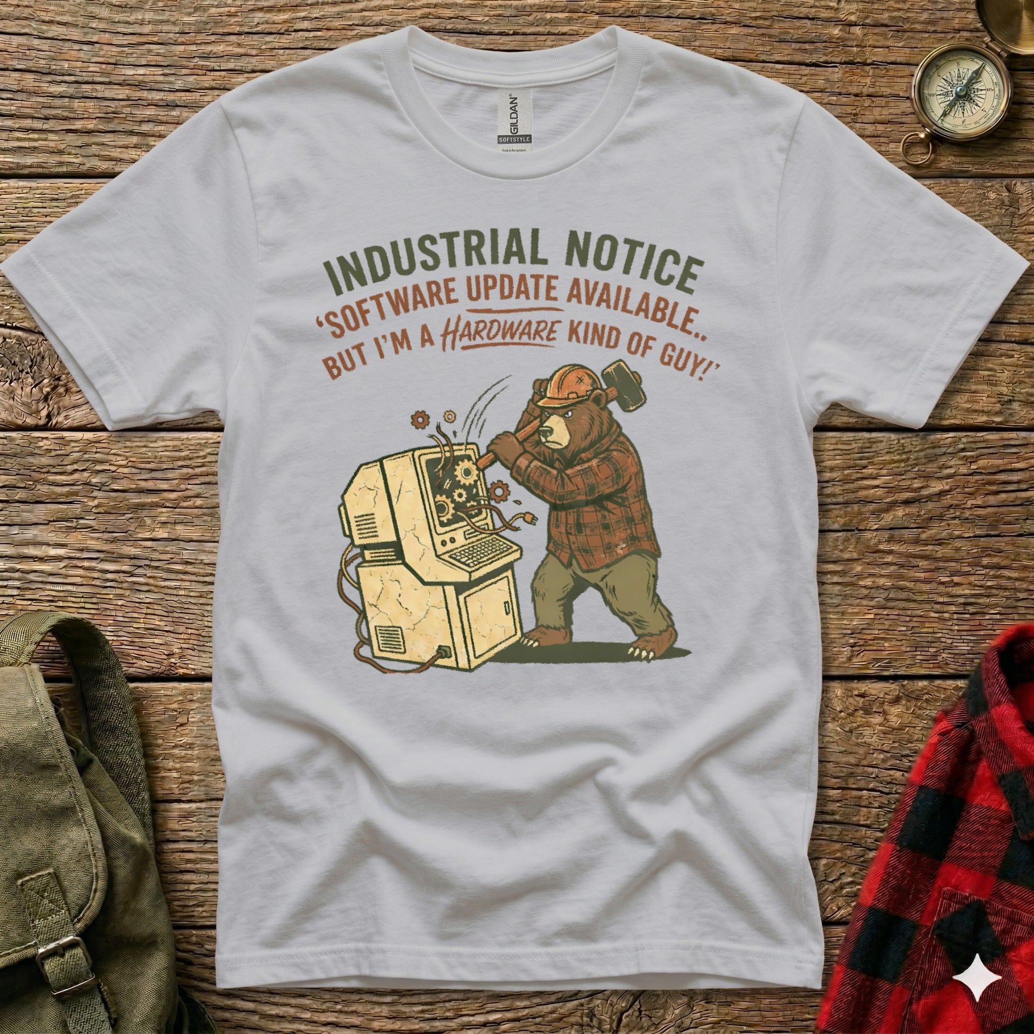 Bear smashing computer with hammer, text "INDUSTRIAL NOTICE 'SOFTWARE UPDATE AVAILABLE.. BUT I'M A HARDWARE KIND OF GUY!'"