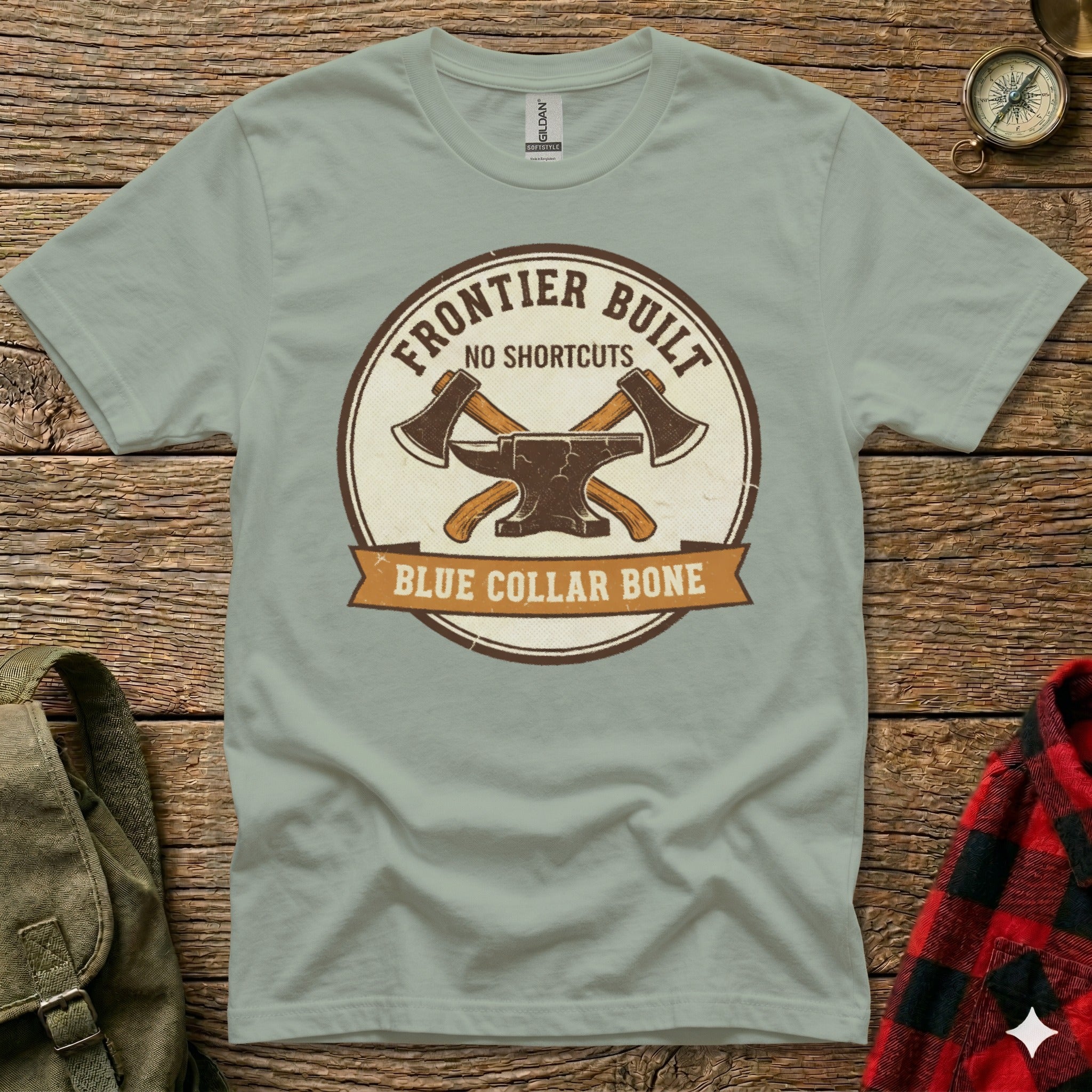 Light gray t-shirt with a circular "Frontier Built No Shortcuts Blue Collar Bone" logo featuring crossed axes.