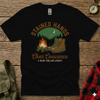 Black t-shirt with "Stained Hands Clear Conscience" text and boots by campfire.