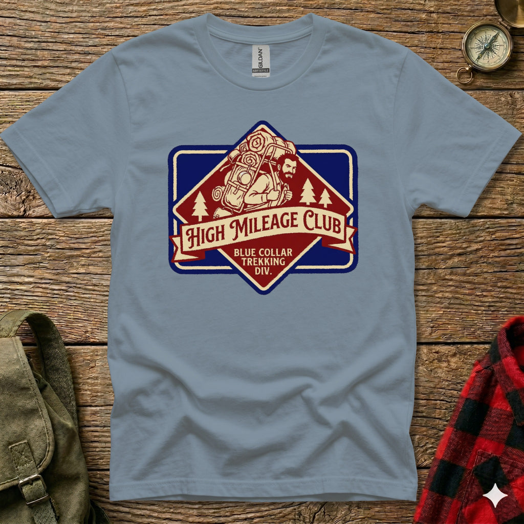 T-shirt with vintage "High Mileage Club" badge and trekking design.