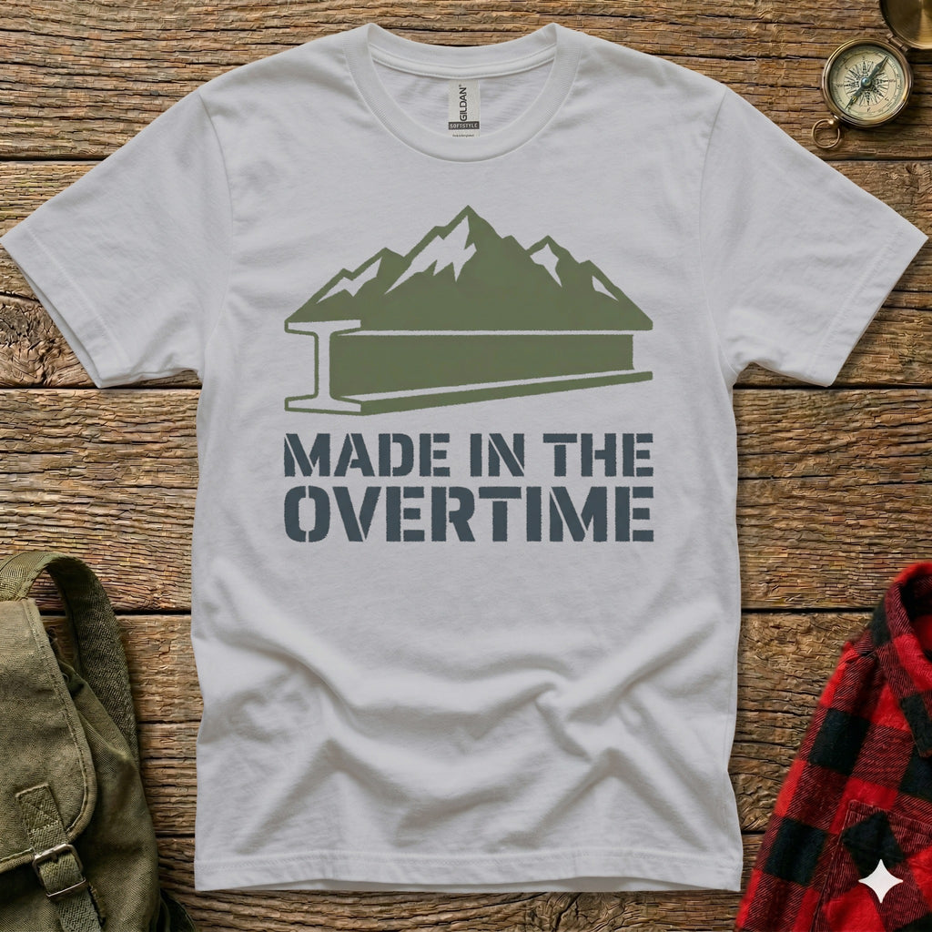 White t-shirt with green mountains and "Made in the Overtime" text.