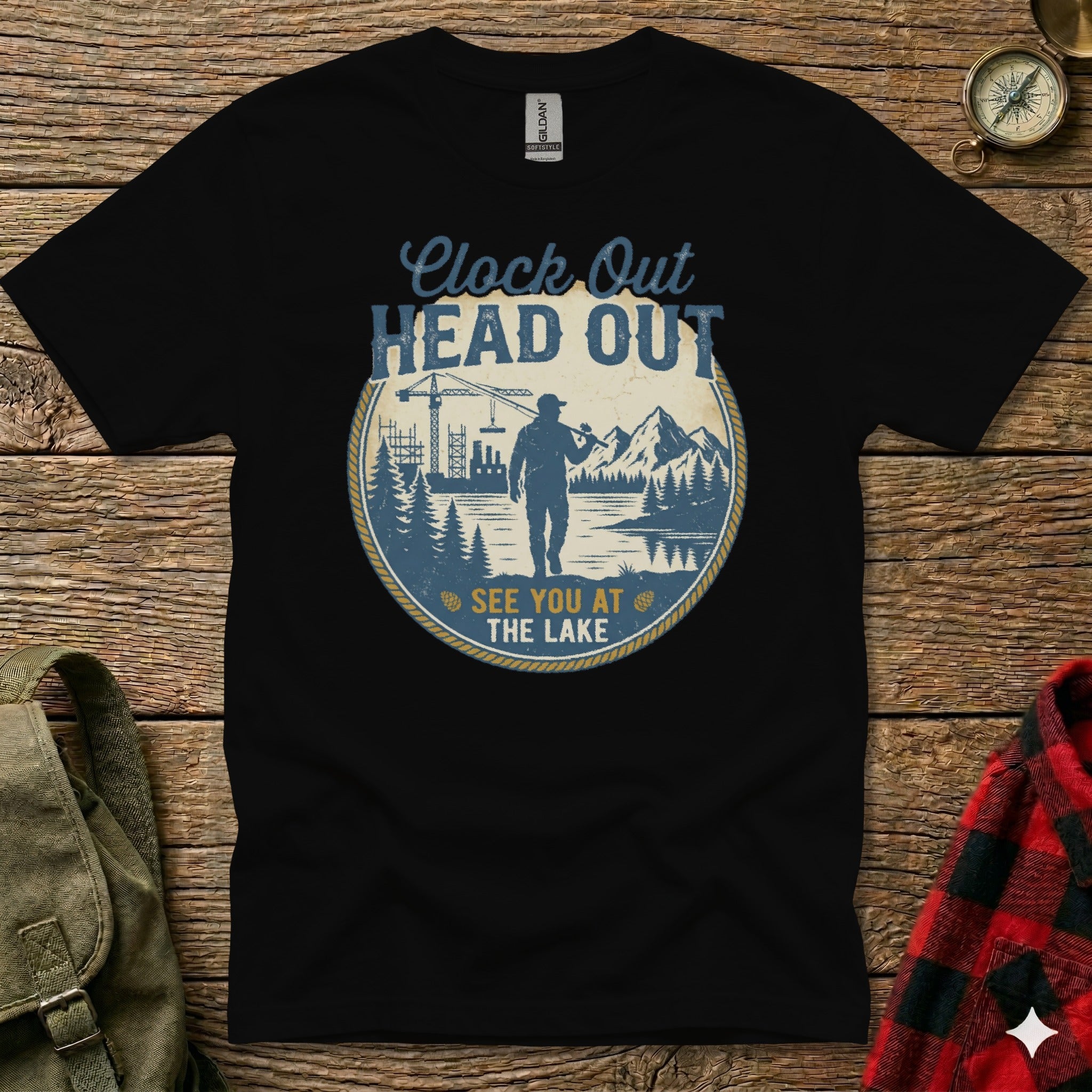 Black t-shirt with "Clock Out Head Out See You at the Lake" graphic.