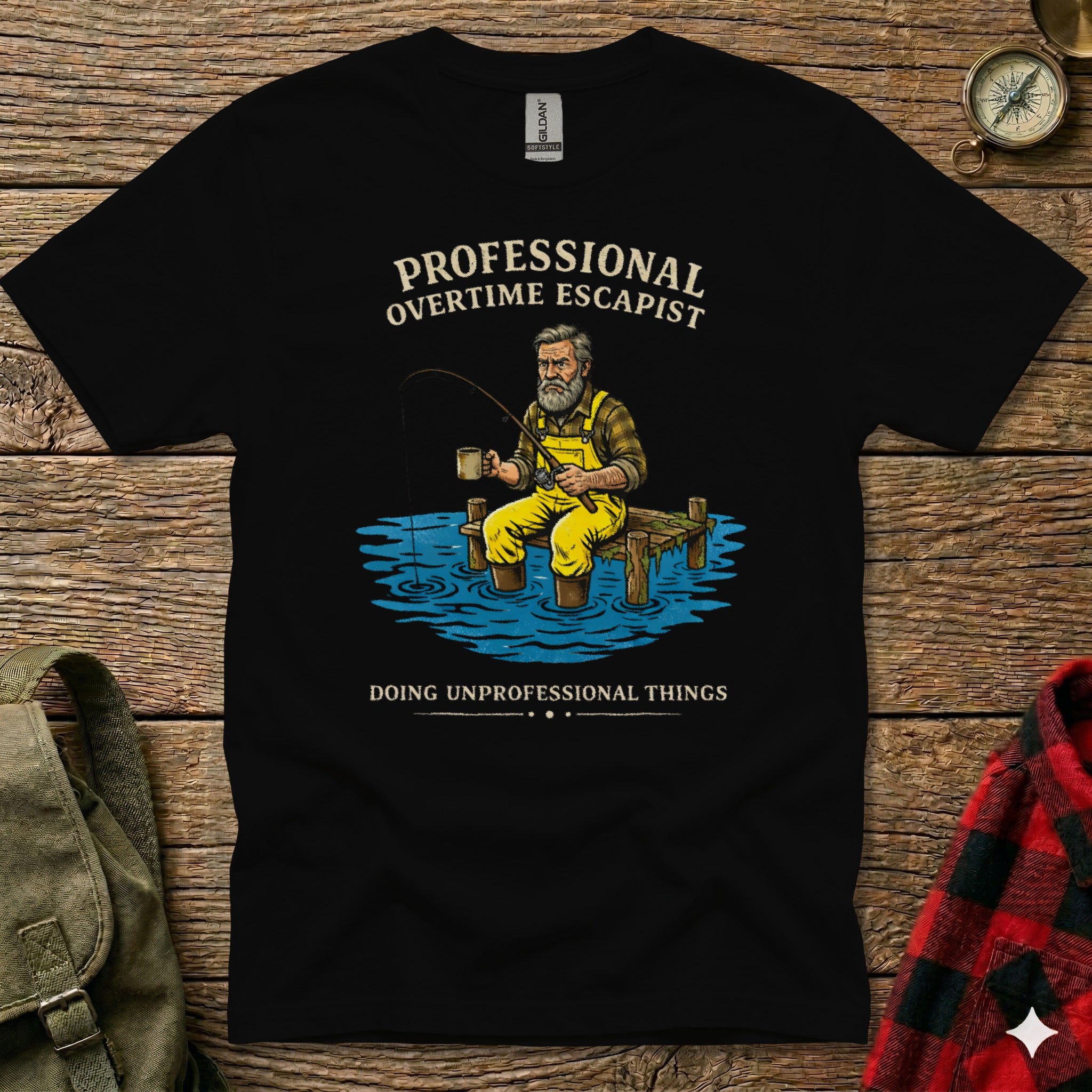 Black t-shirt with graphic of a man fishing, text "PROFESSIONAL OVERTIME ESCAPIST".