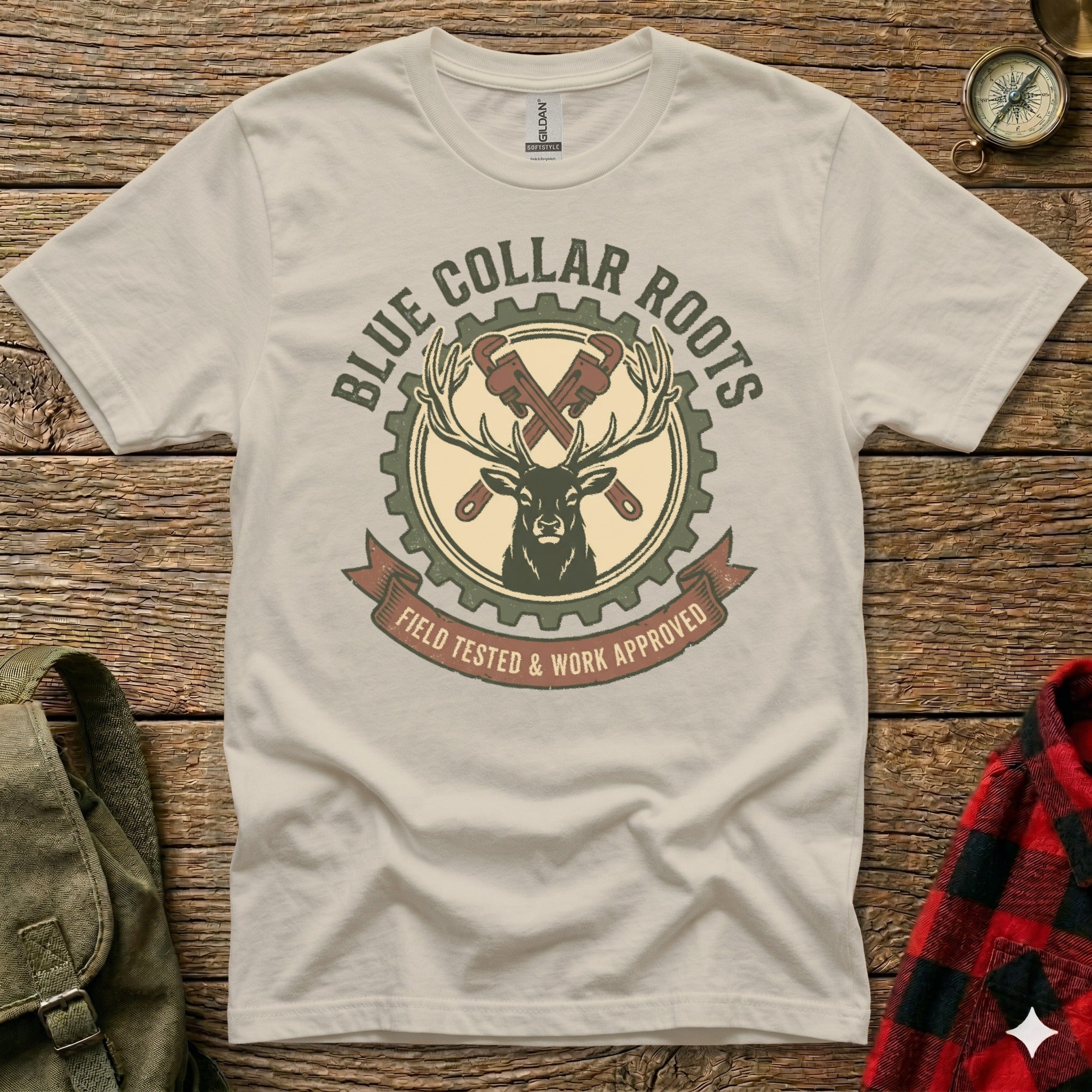 T-shirt with deer, gears, wrenches, and "Blue Collar Roots" text.