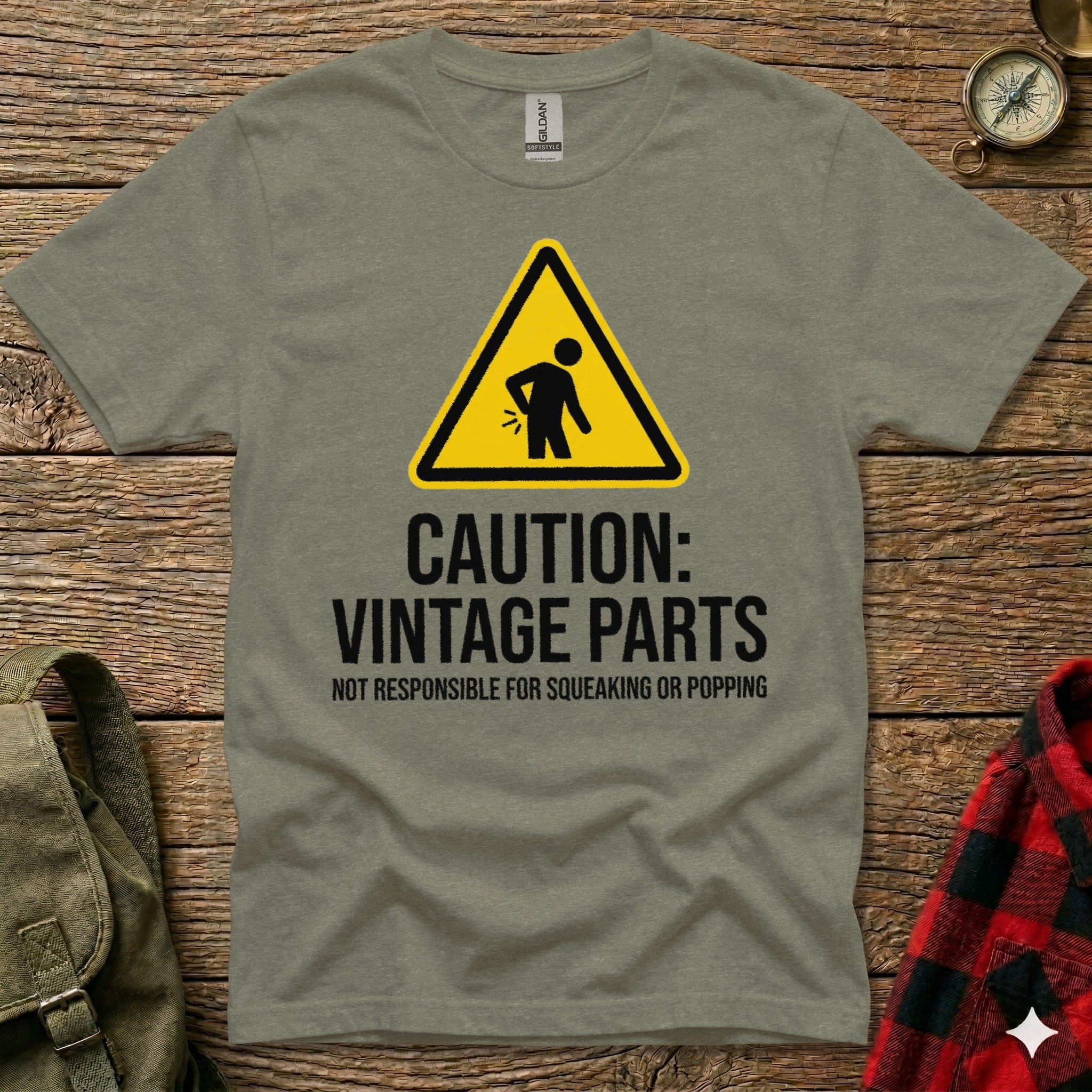 Gray t-shirt with yellow triangle caution sign and text "Vintage Parts".