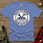 Blue t-shirt with circular logo: "BUILT TO WORK BORN TO FLOAT" and wrench/hammer.