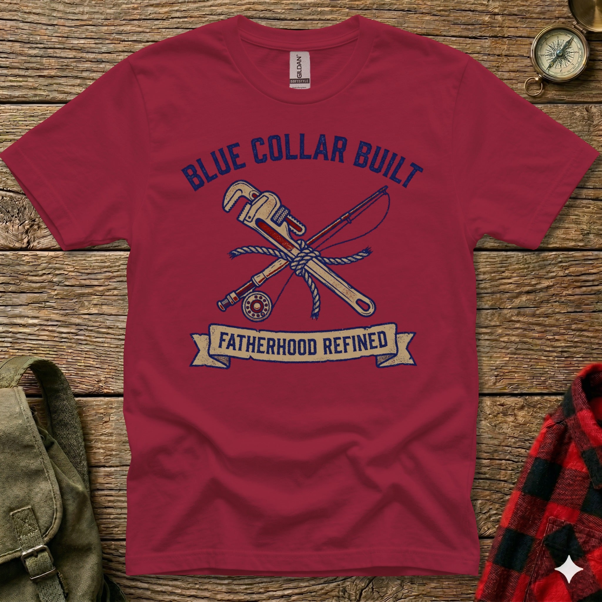 Maroon t-shirt with "Blue Collar Built Fatherhood Refined" text and wrench and fishing rod graphic.