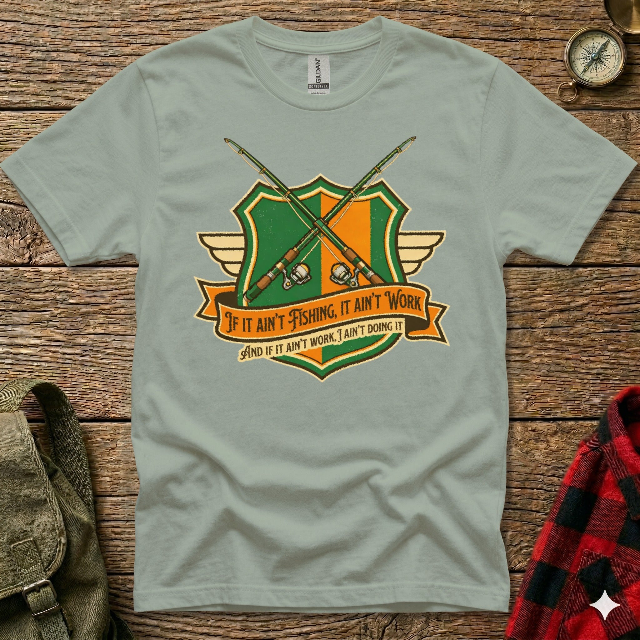 T-shirt with crossed fishing rods on a crest and humorous fishing quote.