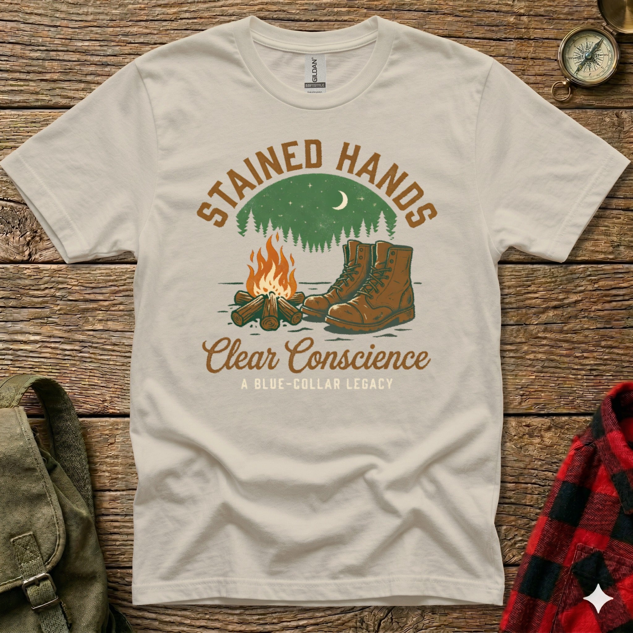 Cream t-shirt with "Stained Hands Clear Conscience" text and campfire scene.