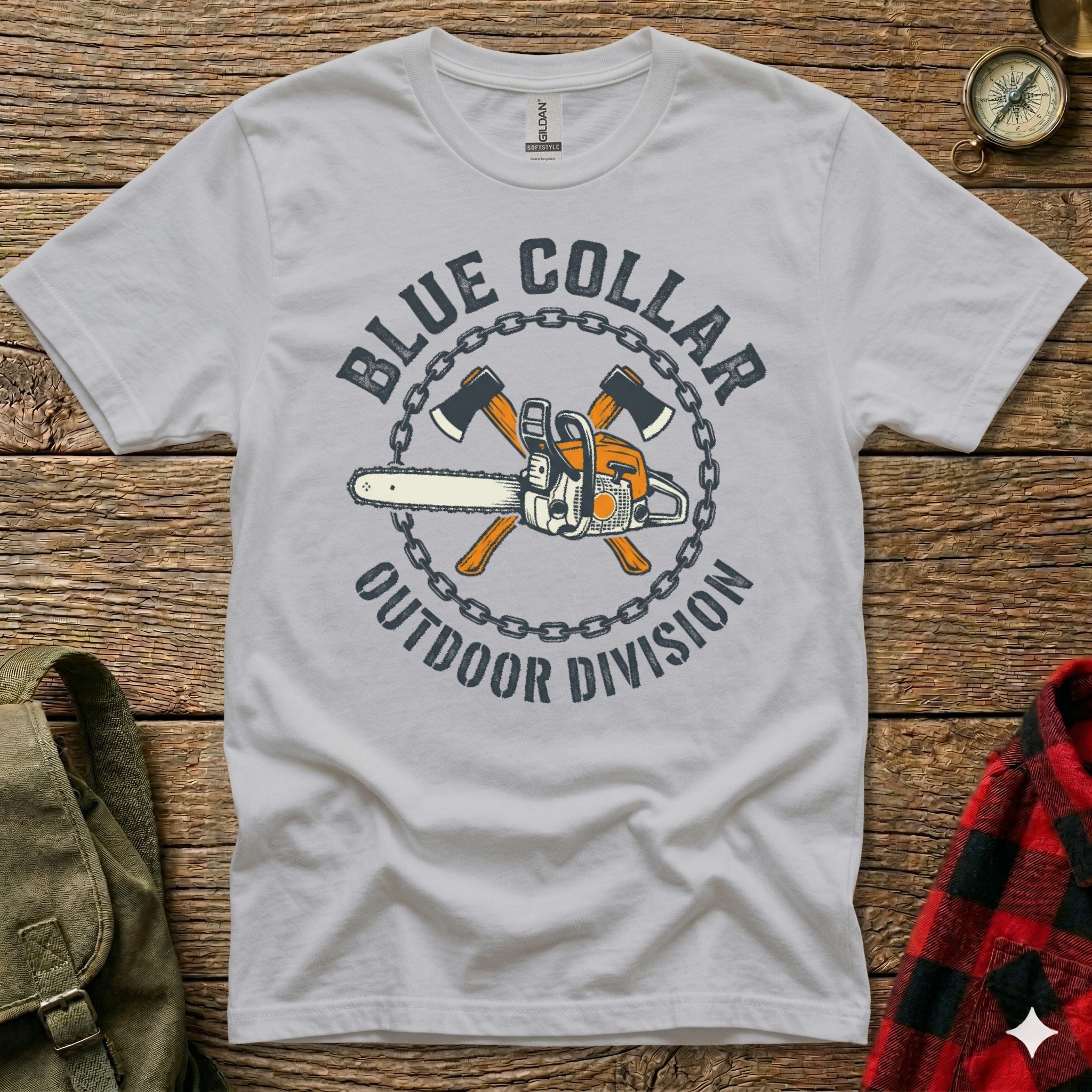 Grey t-shirt with "Blue Collar Outdoor Division" text, chainsaw, and axes.