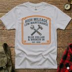 T-shirt with "High Mileage, Low Maintenance, Blue Collar & Broken In" text and tools.