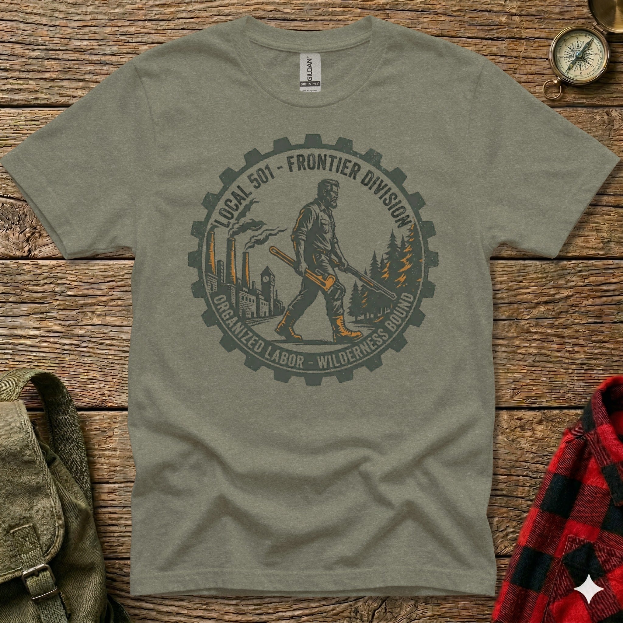 Green t-shirt with a circular graphic of gears, trees, and a worker carrying tools.