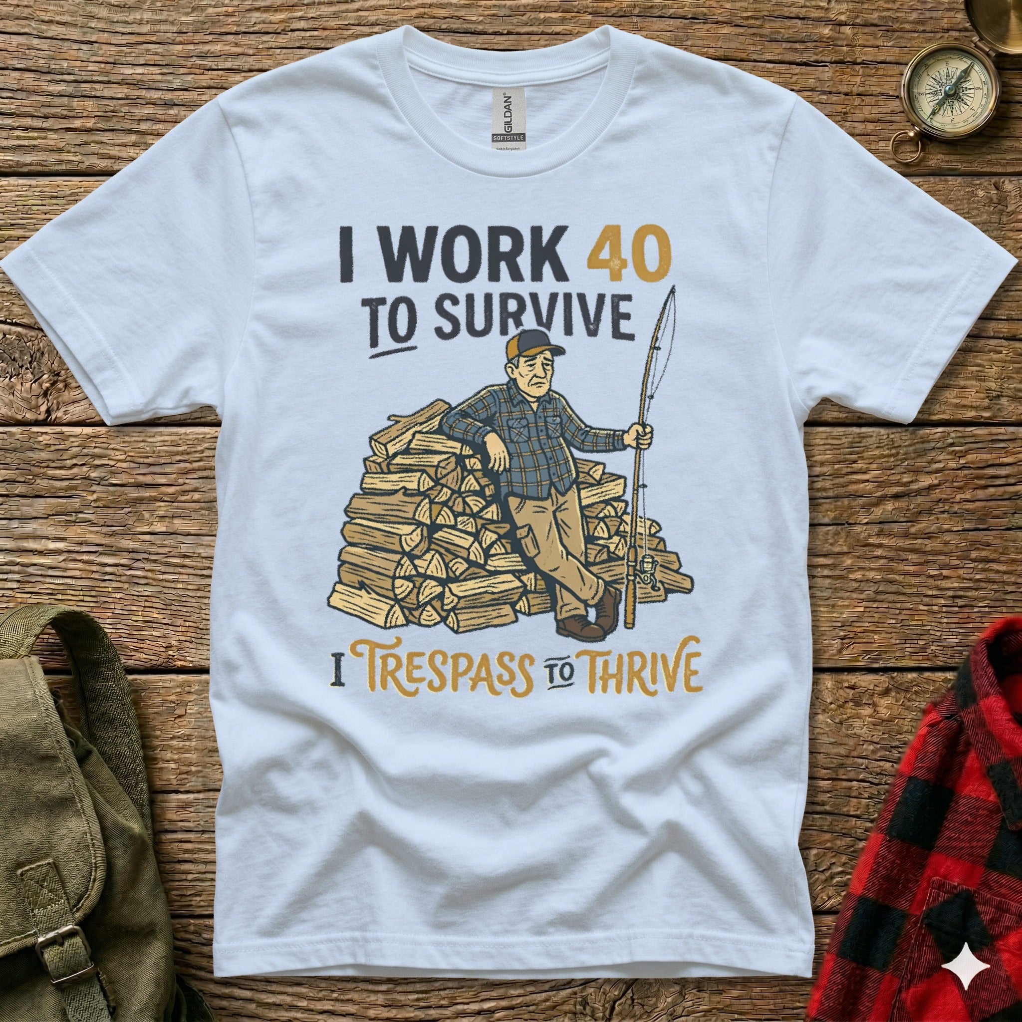 White t-shirt with text "I work 40 to survive. I trespass to thrive."