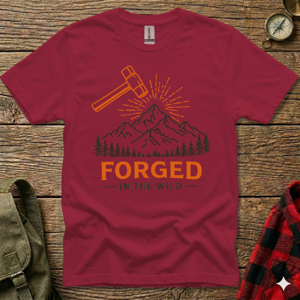 Maroon t-shirt with mountain and "Forged In The Wild" text graphic.