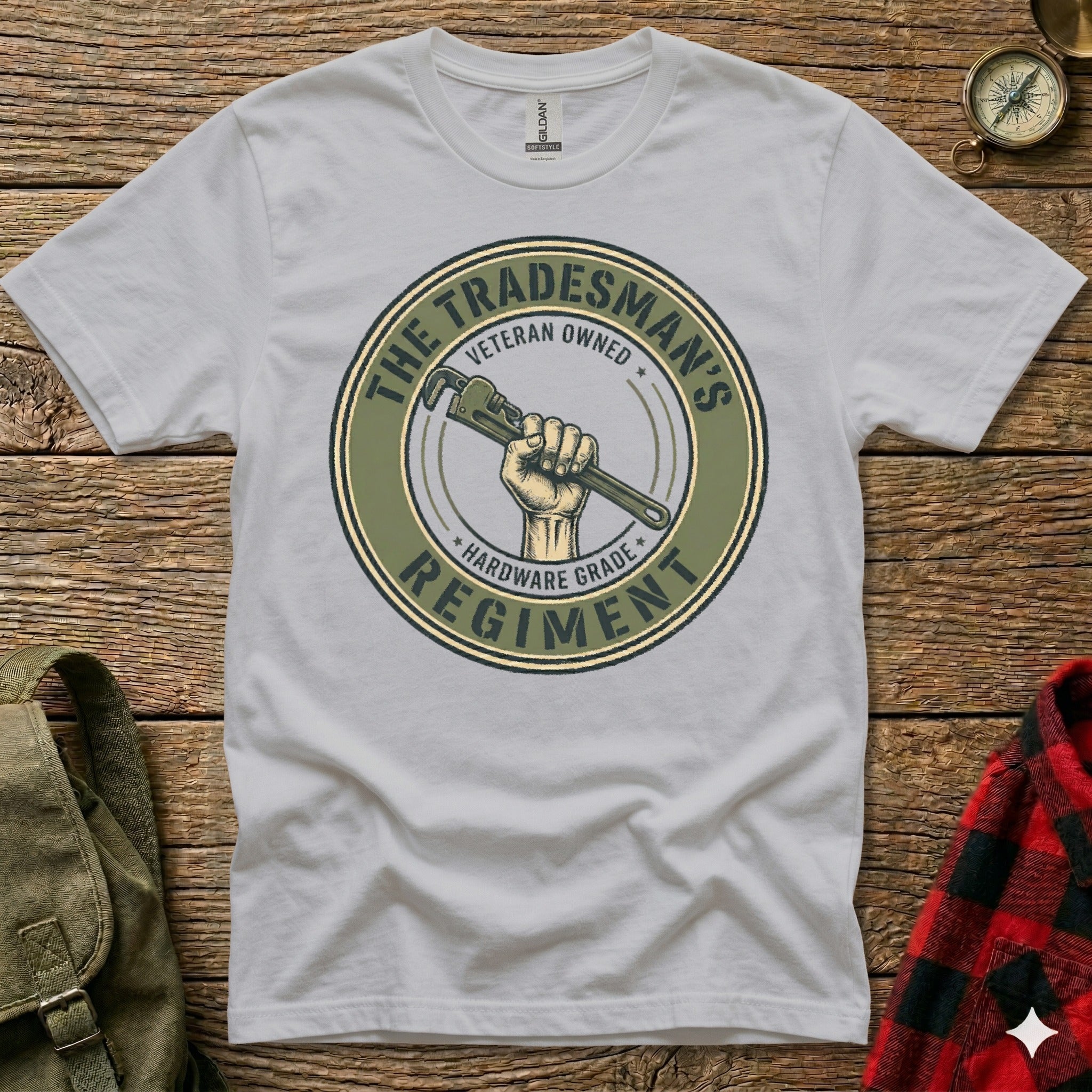 Tradesman's Regiment veteran owned hardware grade logo on a light grey t-shirt.