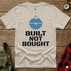 T-shirt with mountain and saw graphic, text "BUILT NOT BOUGHT".