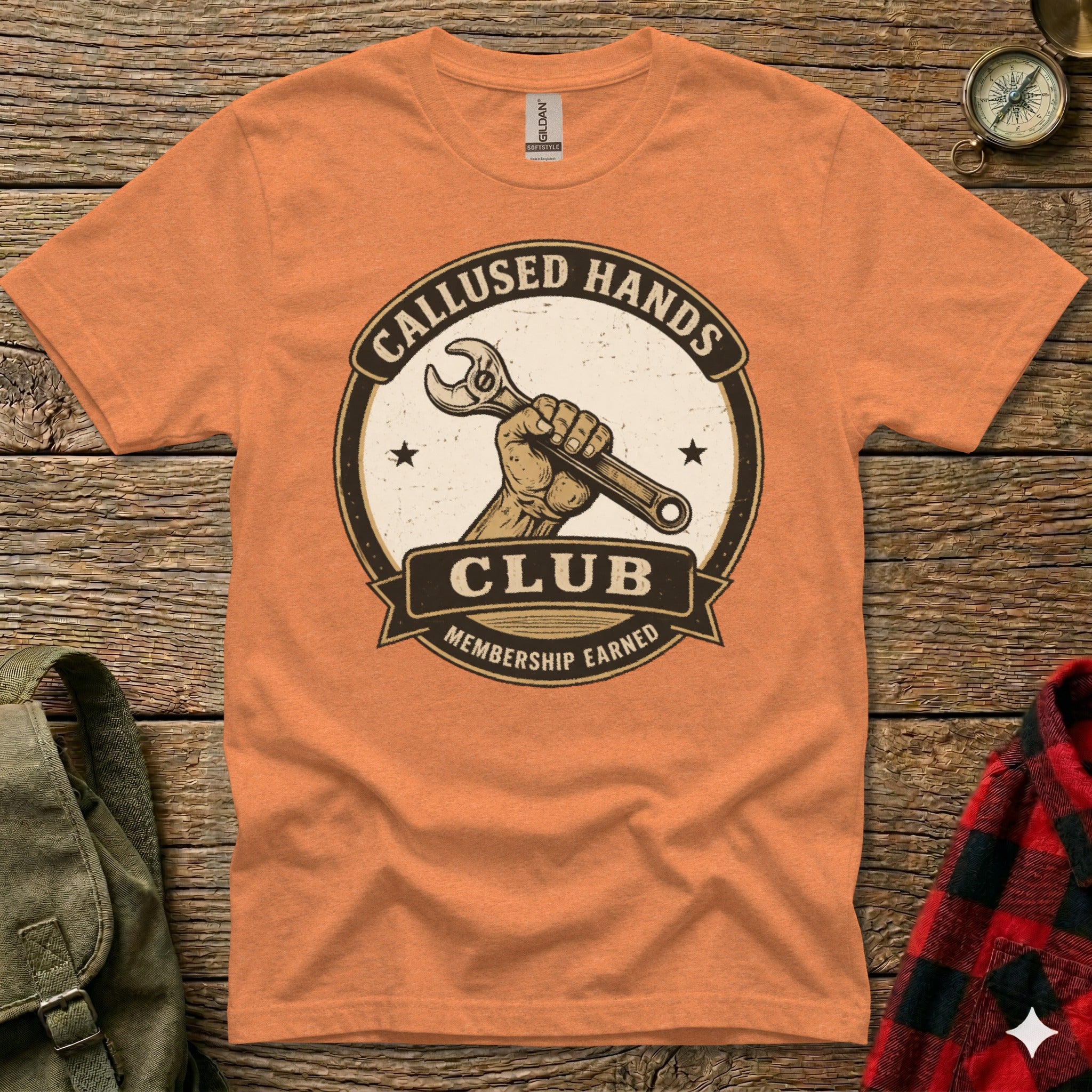 Orange t-shirt with "Callused Hands Club" and a wrench graphic.