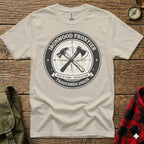 Cream t-shirt with "Ironwood Frontier Tradesmen Union" circular logo and crossed hammer and axe.
