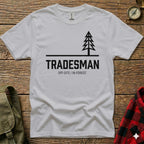 White t-shirt with "TRADESMAN OFF-SITE/IN-FOREST." and a pine tree graphic.