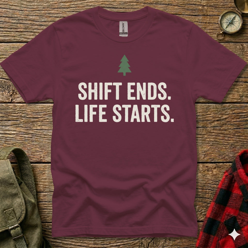 Maroon t-shirt with white text "SHIFT ENDS. LIFE STARTS." and a green tree graphic.