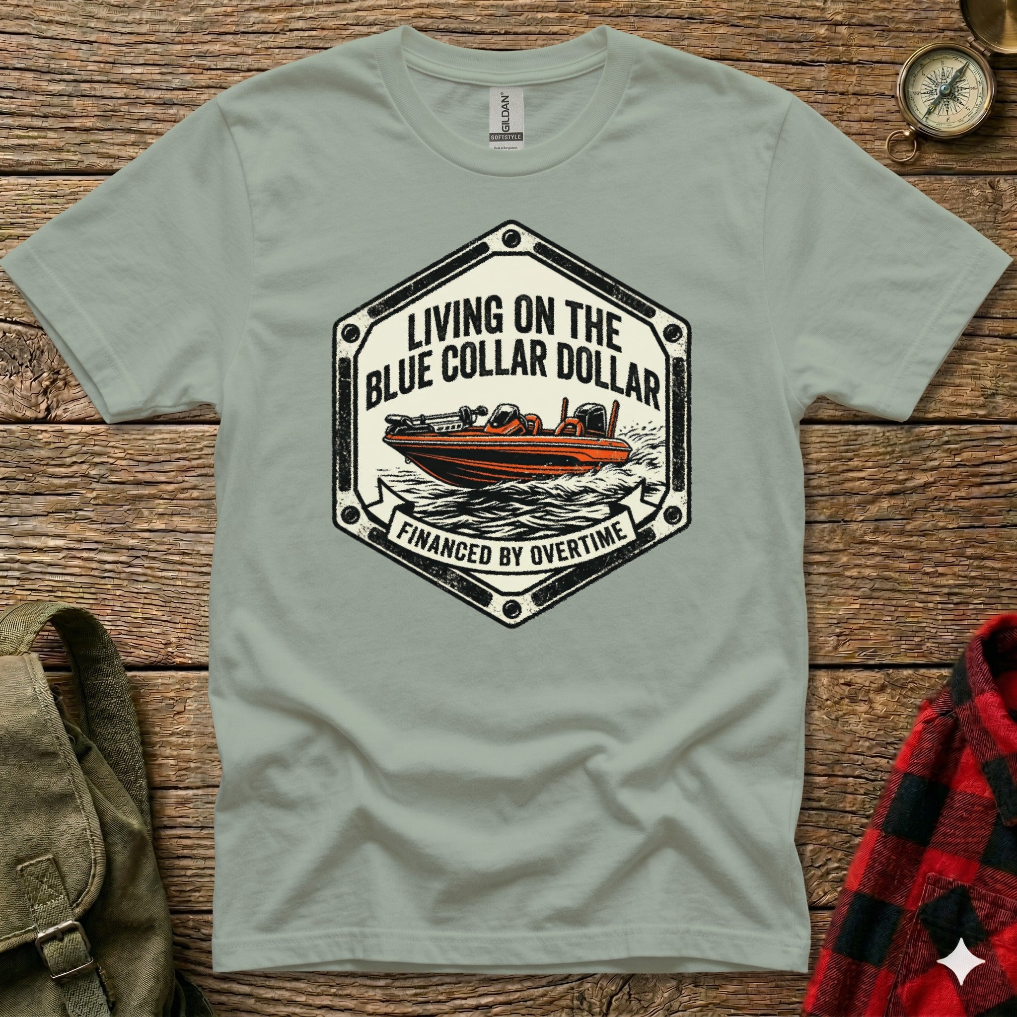 T-shirt with "Living on the Dollar Financed by Overtime" text and a boat illustration.