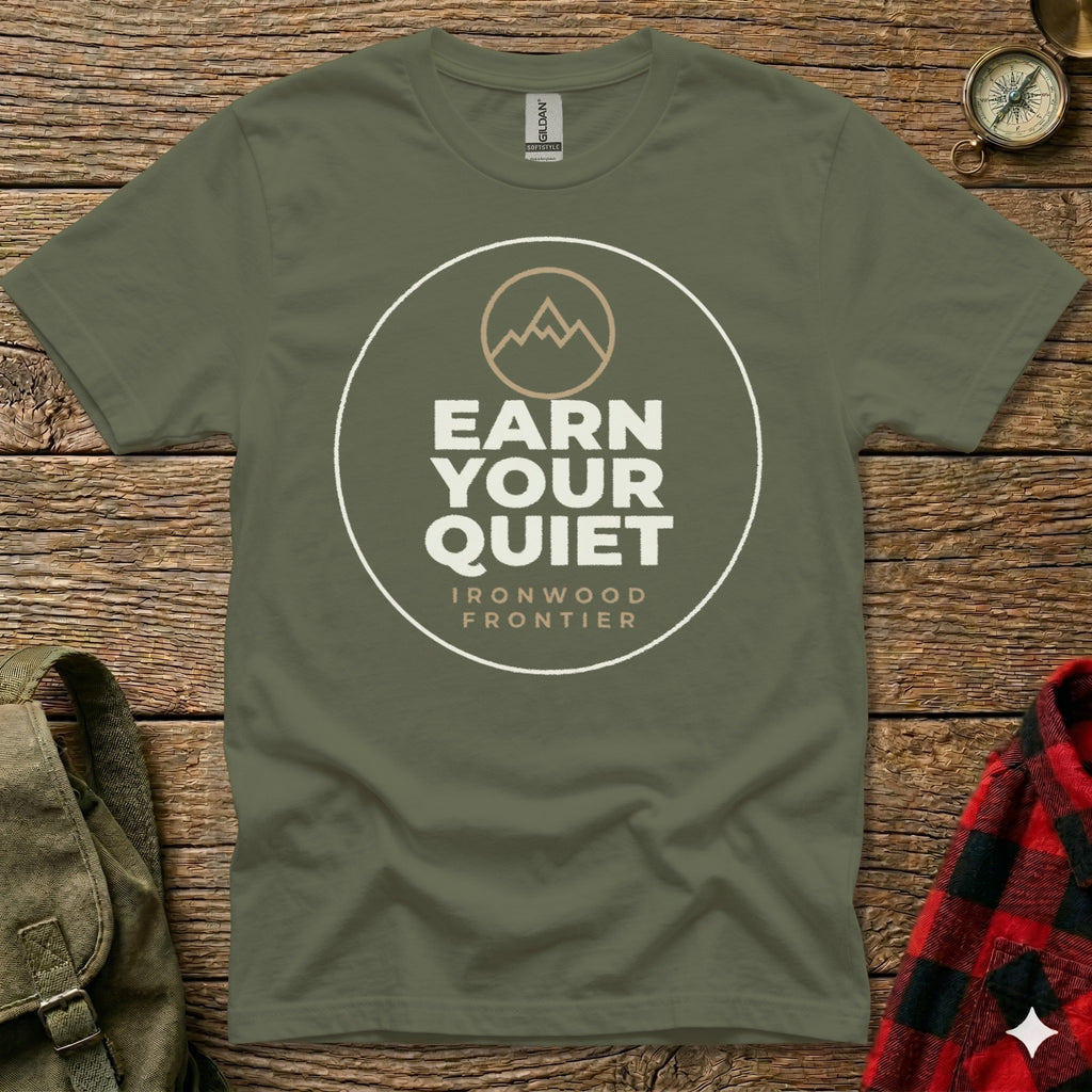 Olive green t-shirt with "EARN YOUR QUIET" and mountain graphic.
