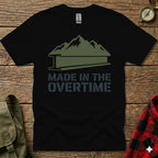 Black t-shirt with green mountains and "Made in the Overtime" text.
