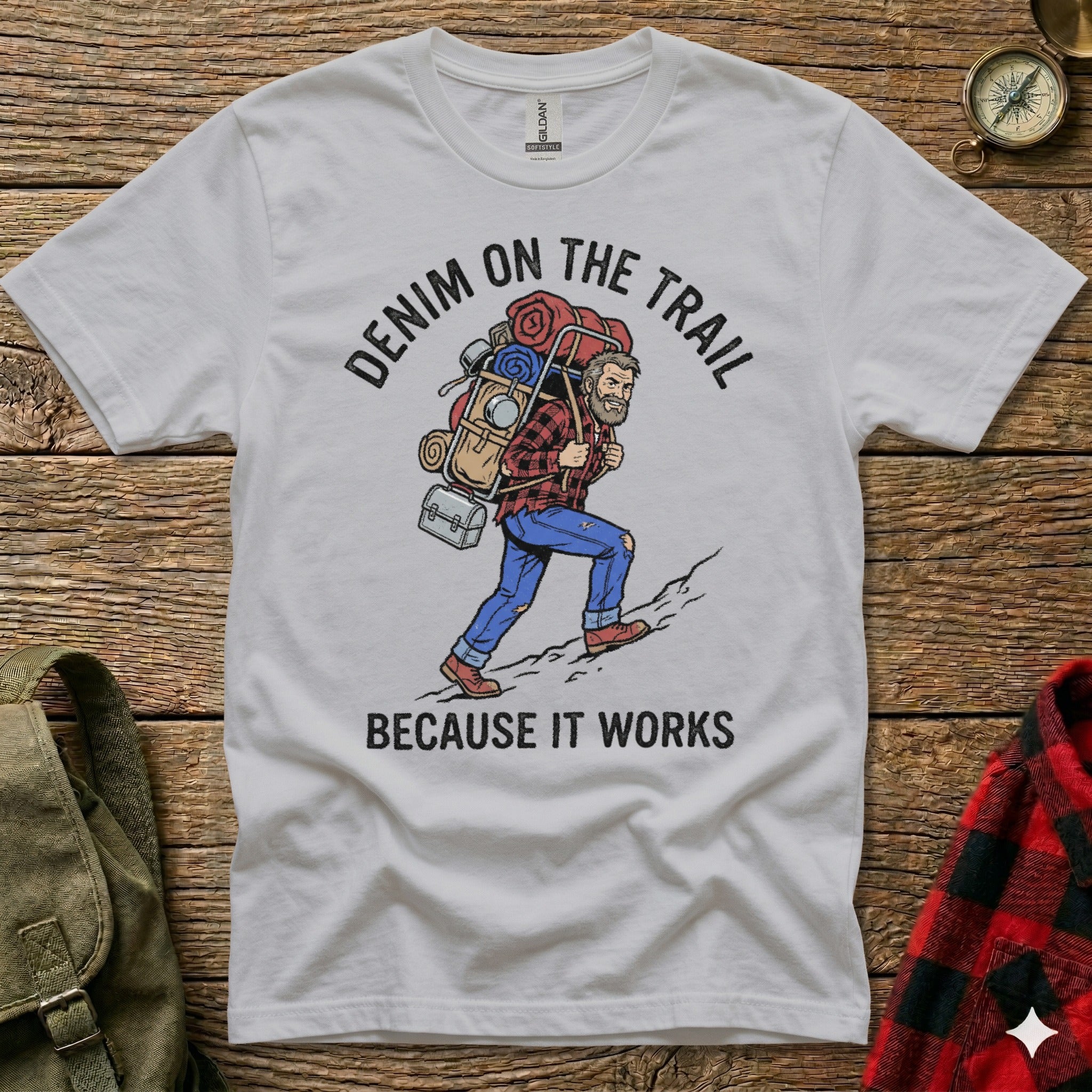 T-shirt with graphic of hiker and text "DENIM ON THE TRAIL BECAUSE IT WORKS".