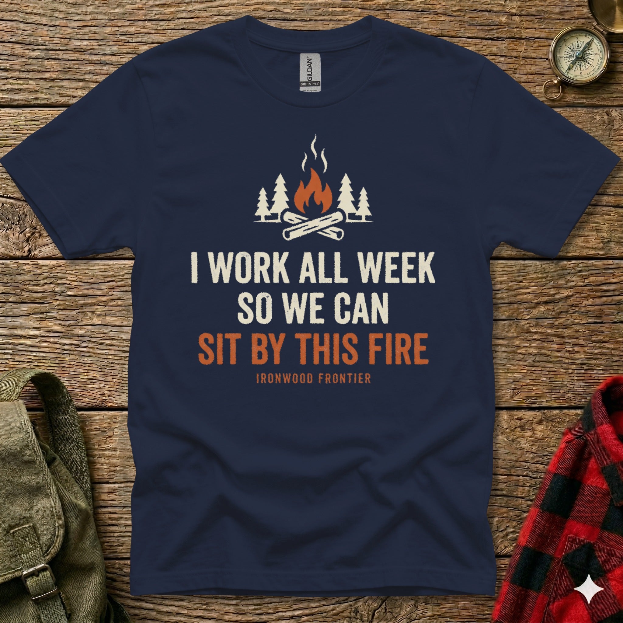 Dark blue t-shirt with "I work all week so we can sit by this fire" graphic.