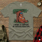 Bear in hard hat sits under tree holding coffee mug, text reads "I work to support my outdoor addiction."