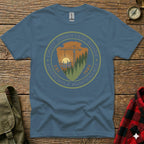 Blue t-shirt with "Chief Mountain Guide Household Maintenance" circular logo and "Est. 1985".