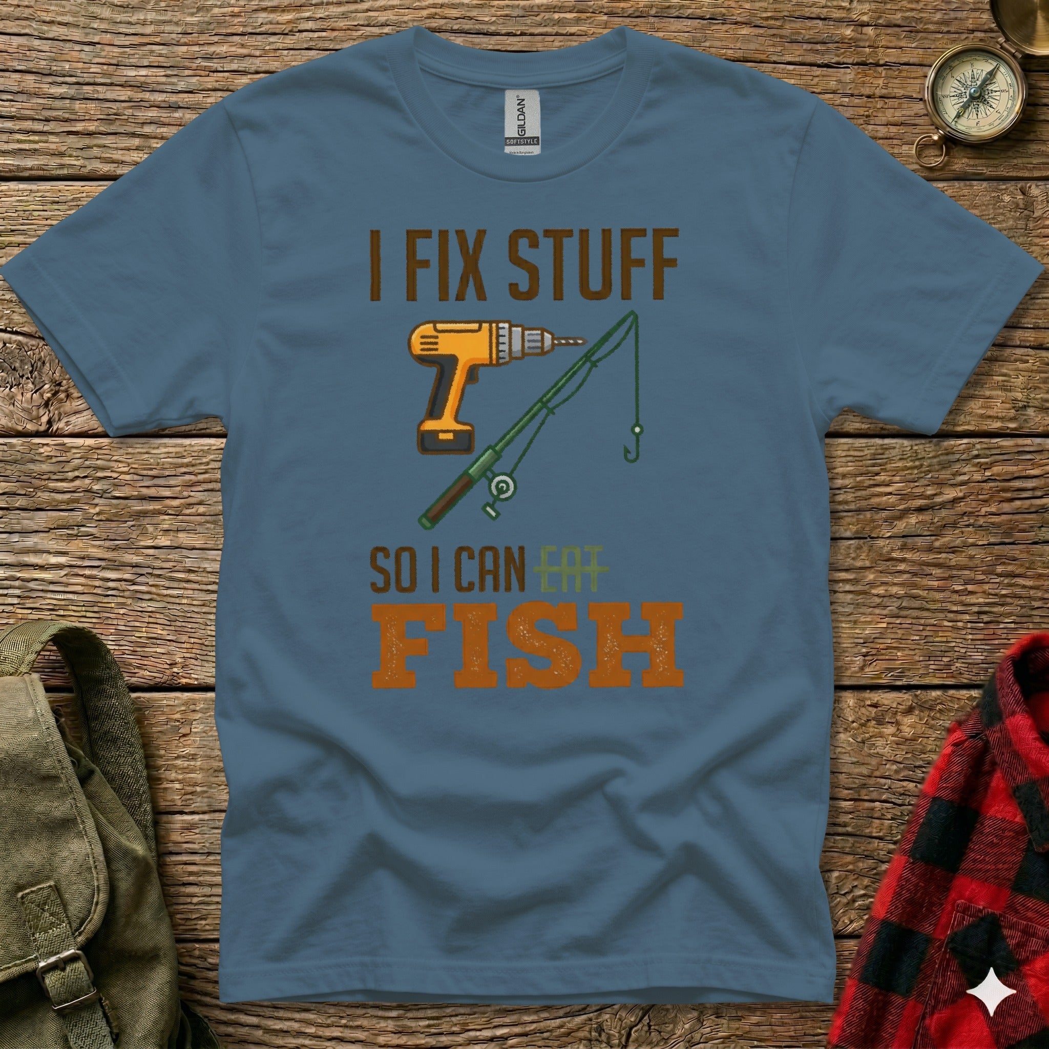 Blue t-shirt with "I FIX STUFF SO I CAN FISH" text and fishing rod graphic.