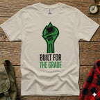 White t-shirt with green wrench graphic and "BUILT FOR THE GRADE" text.