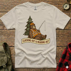 Bear wearing hard hat and vest fishes by tree, text reads "Clocking Out & Heading Out."