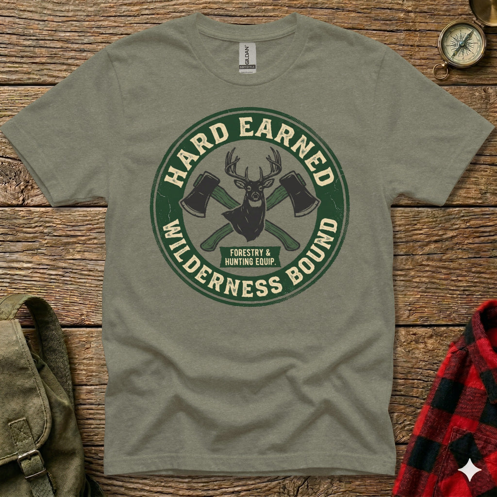 Green t-shirt with "Hard Earned Wilderness Bound" crossed axes logo.