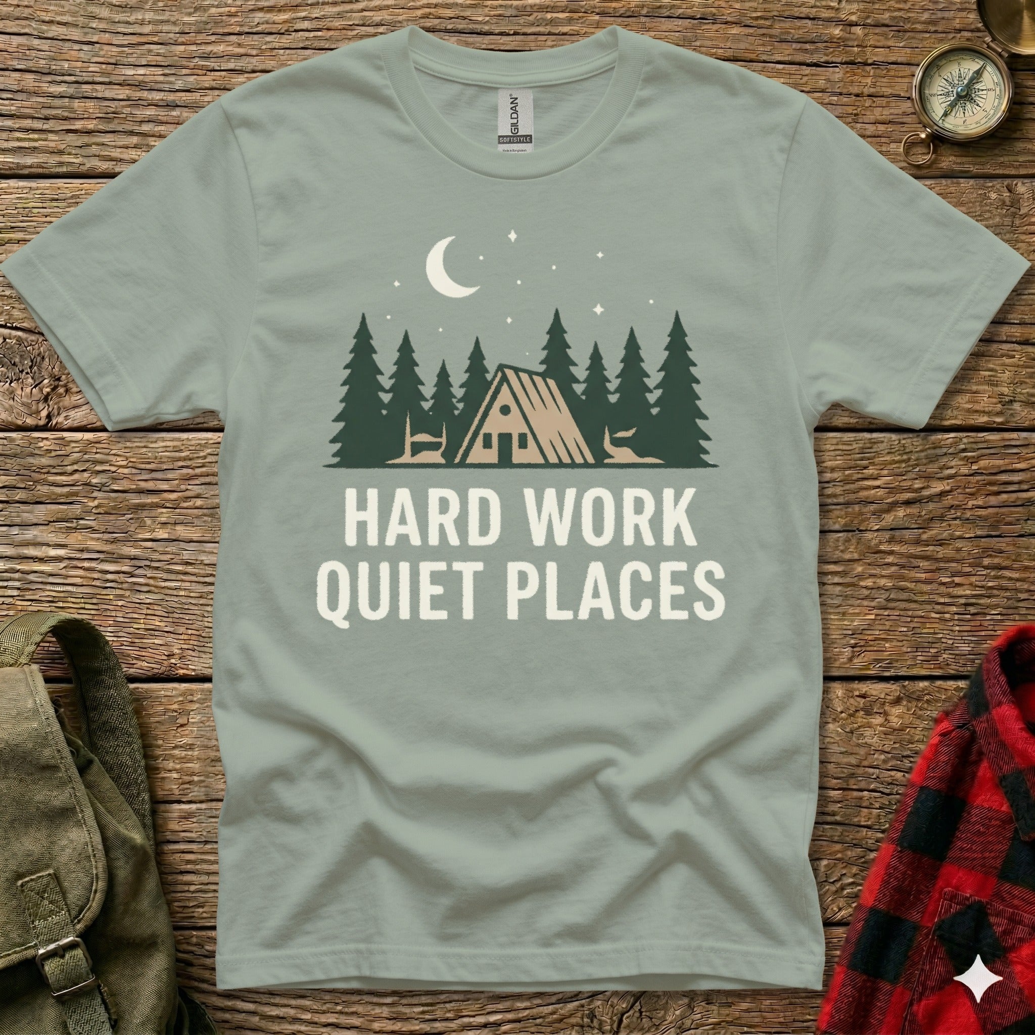 T-shirt with forest scene and text "HARD WORK QUIET PLACES".