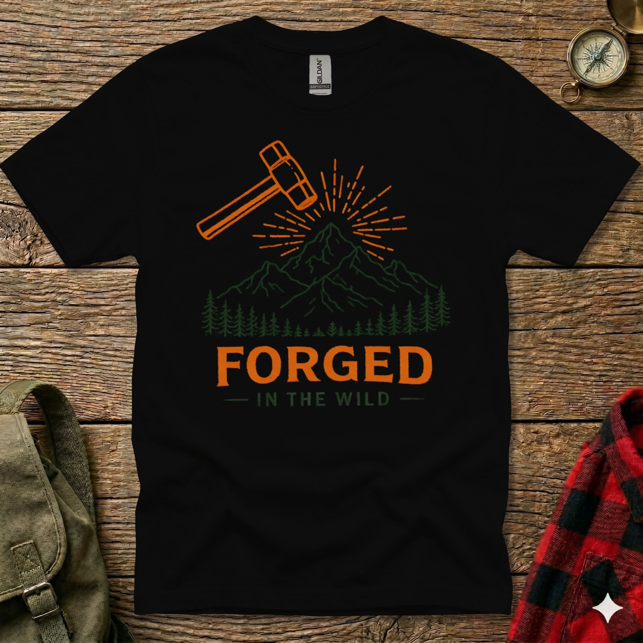 Black t-shirt with "FORGED IN THE WILD" text and hammer graphic.