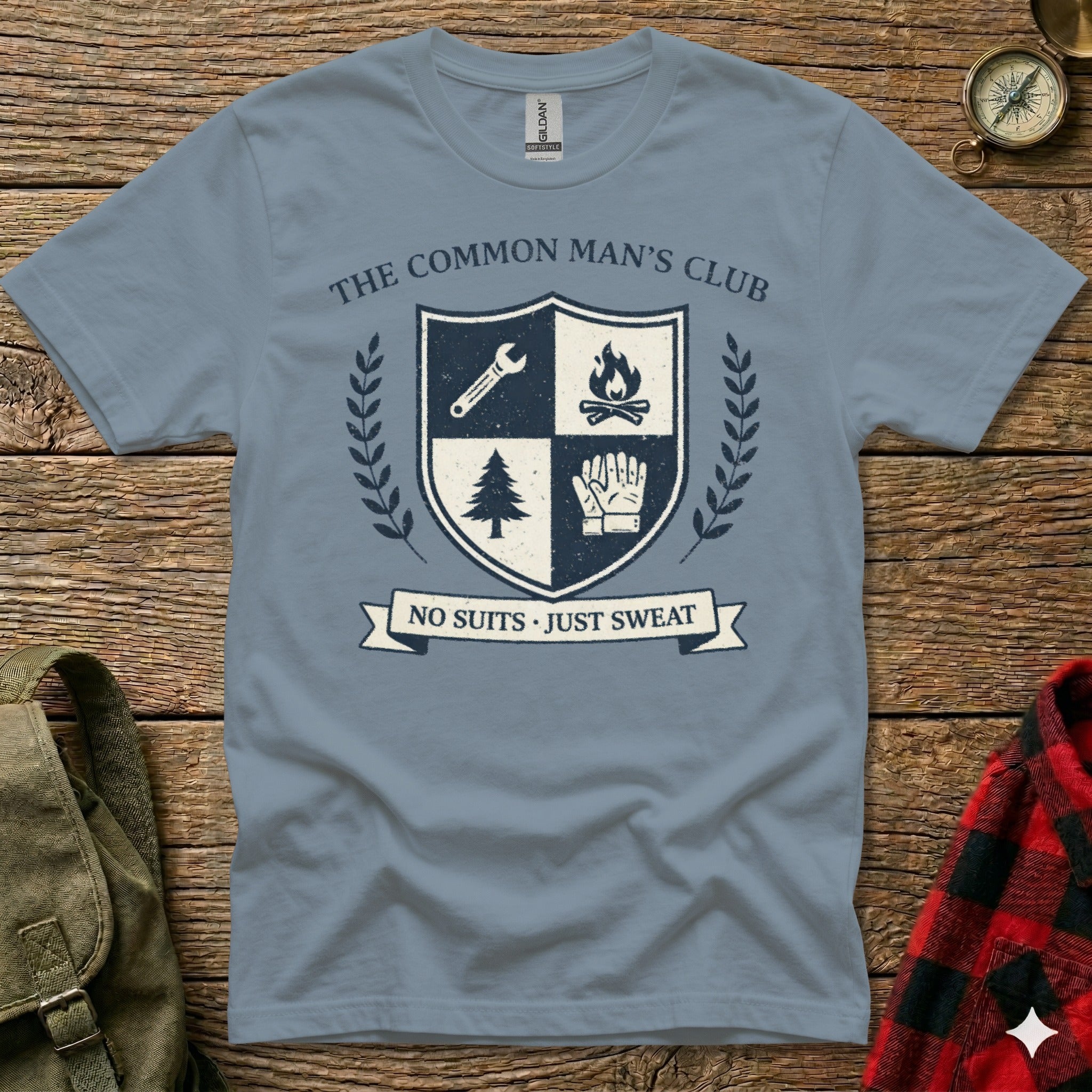 The Common Man's Club crest with tools, fire, gloves, and tree: "No Suits Just Sweat."