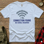 White t-shirt with "CONNECTION FOUND NO SIGNAL REQUIRED" and mountain trees graphic.