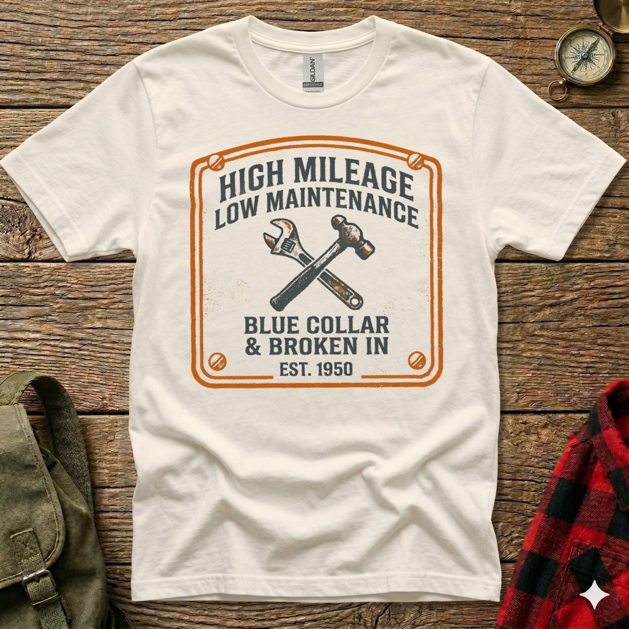 White t-shirt with "High Mileage Low Maintenance Blue Collar Est. 1950" and crossed tools graphic.