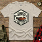 T-shirt with boat graphic and text "Living on the Blue Collar Dollar Financed by Overtime".