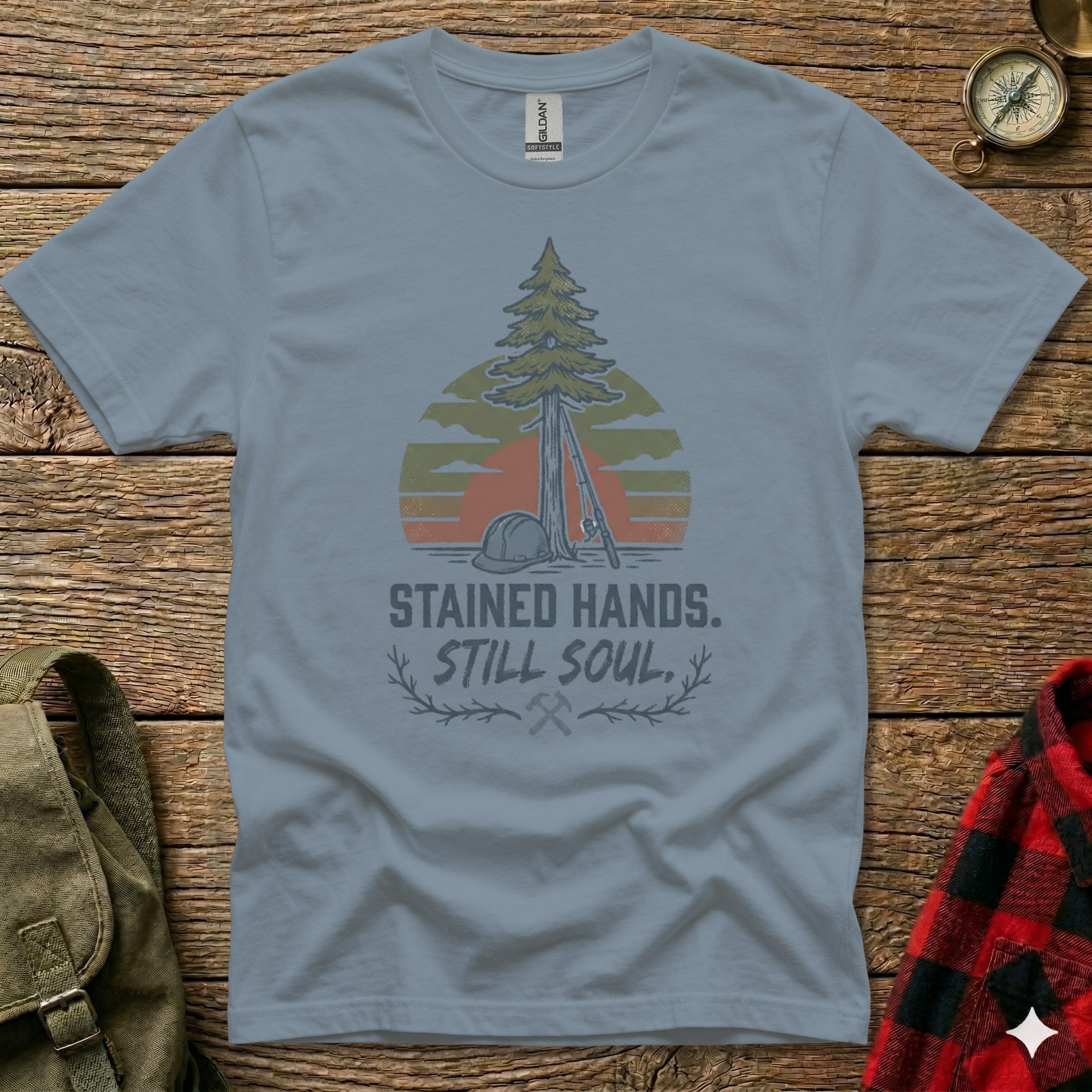 Gray t-shirt with vintage tree, sun, and construction helmet graphic and text.
