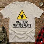 Cream t-shirt with caution sign and "Vintage Parts" text.