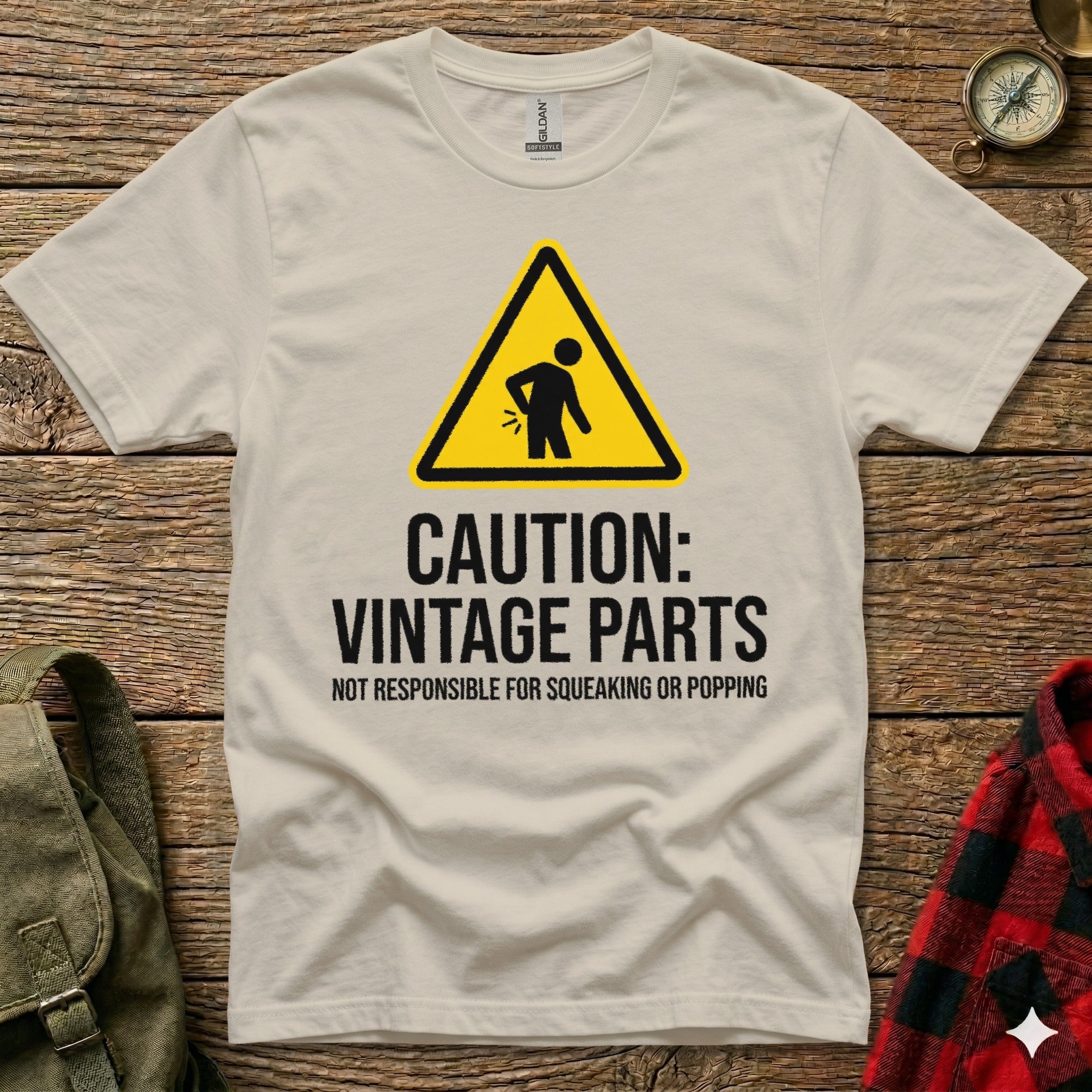 Cream t-shirt with caution sign and "Vintage Parts" text.