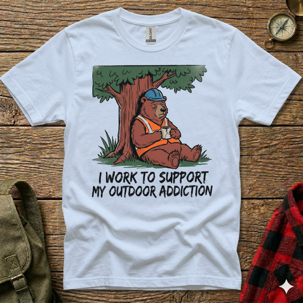 Bear in hard hat sips coffee under tree on white t-shirt with text.