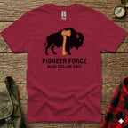 Maroon t-shirt with bison and axe graphic, "PIONEER FORCE" and "BLUE COLLAR GRIT" text.