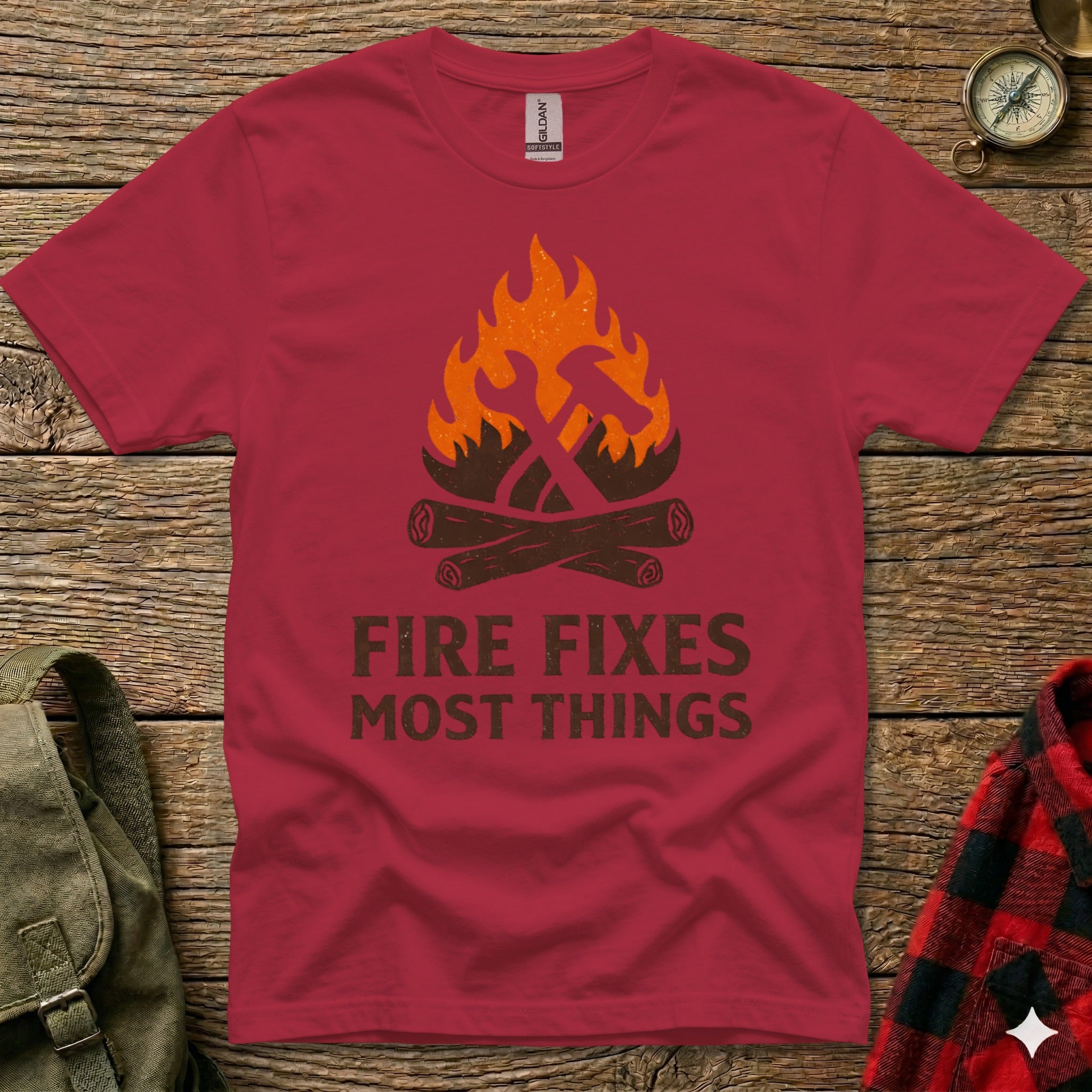 Crimson t-shirt with "Fire Fixes Most Things" graphic and crossed tools.