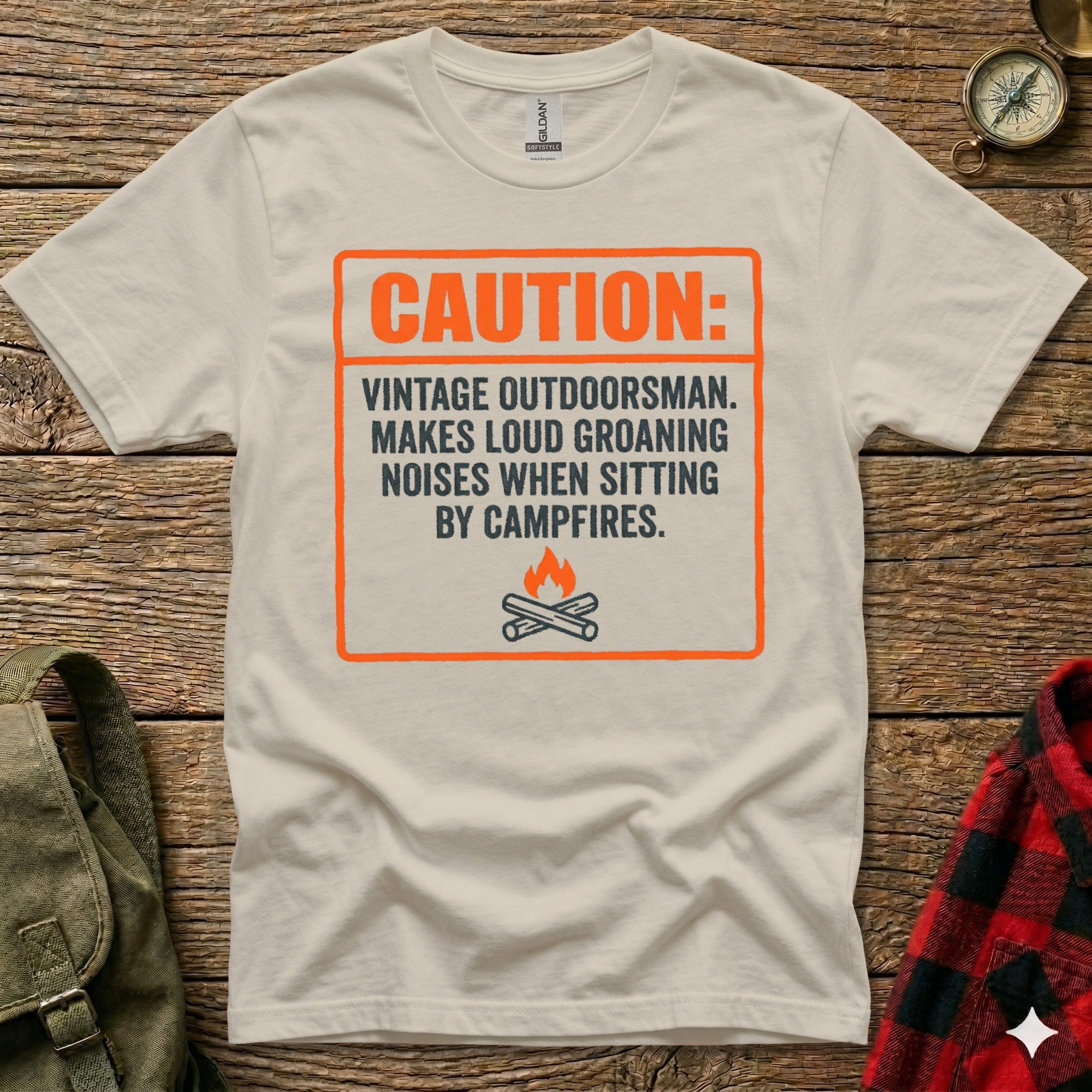 White t-shirt with orange caution sign about a "vintage outdoorsman".