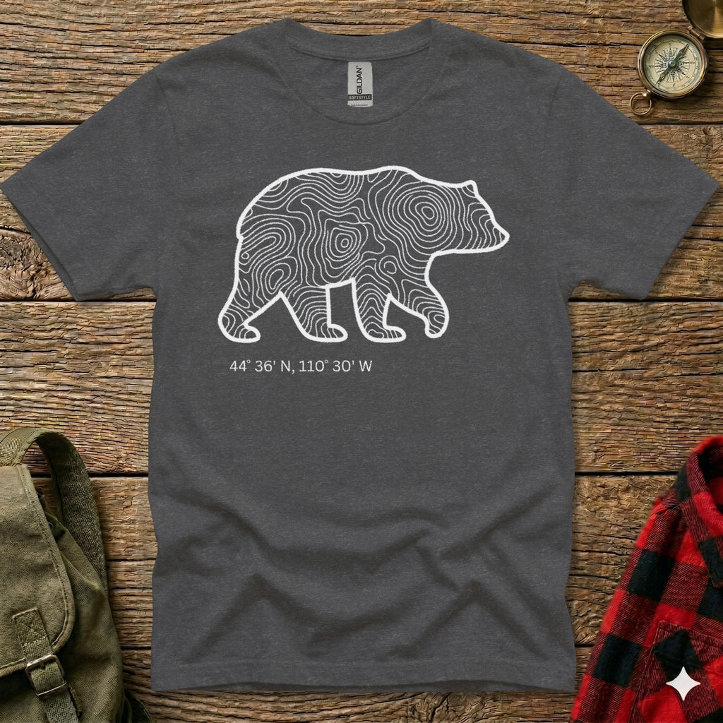 Dark t-shirt with white bear outline filled with topographic lines and coordinates.